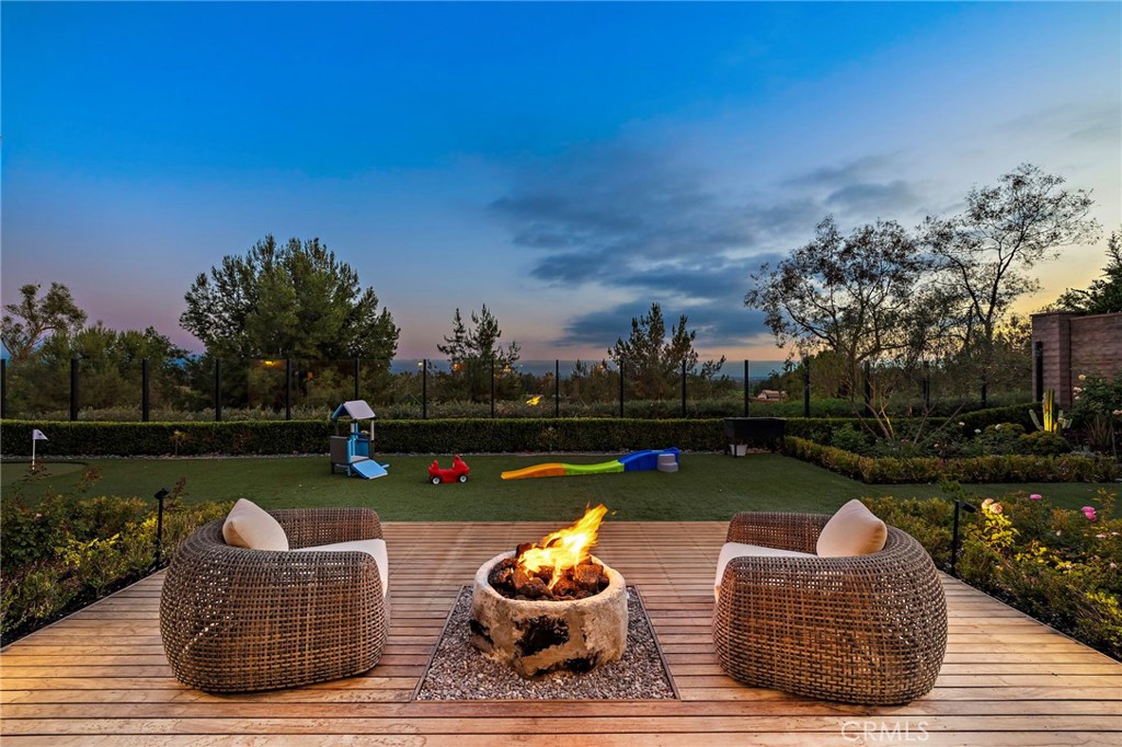 Welcome to 137 Sunset Cove, Irvine — an exceptionally rare offering on one of the most sought-after, view-facing streets in all of Irvine. No homes have come on the market on Sunset Cove with this kind of view and lot size in over two years — making this a truly unique opportunity.
Sitting on an oversized premium lot of over 10,000 square feet, this estate is a rare gem, especially within a guard-gated community where large parcels are nearly impossible to find at this price range.
Every inch of the home and yard has been meticulously upgraded with high-end finishes, from thoughtfully designed landscaping to luxurious indoor enhancements — blending beauty, comfort, and functionality. The California room has been fully enclosed with permits, transforming it into a year-round indoor living space that enhances flexibility and usable square footage.
The primary suite is conveniently located on the first floor, featuring direct access to the backyard through large sliding glass doors. Imagine waking up in bed to the tranquil, tree-lined views beyond your private glass fence — it’s the perfect retreat.
Inside, the home offers a modern open-concept layout with soaring ceilings, designer lighting, and spacious living areas. The chef’s kitchen is the heart of the home, equipped with top-of-the-line stainless steel appliances, an oversized waterfall island, and elegant custom cabinetry, ideal for everyday luxury and entertaining.
Additional highlights include:
• A rare Italian-inspired front and middle courtyard with a staircase that leads directly to the second-floor loft — both practical and architecturally distinctive.
• A shared circular driveway with neighboring homes, offering both enhanced curb appeal and an extra-spacious front yard perfect for children’s play or additional outdoor living.
• A generous three-car garage and rare layout of two bedrooms on each floor.
Enjoy a low-density community with abundant orchards and mature landscaping, award-winning Irvine schools, low HOA dues, and remarkably low cost of ownership. Located near Irvine Spectrum, Woodbury Town Center, top dining, parks, and with easy access to major freeways and beaches, this home offers the very best of luxury and convenience.
Don’t miss this rare opportunity to own a landmark home in one of Irvine’s most prestigious communities. Schedule your private tour today and experience luxury living redefined.