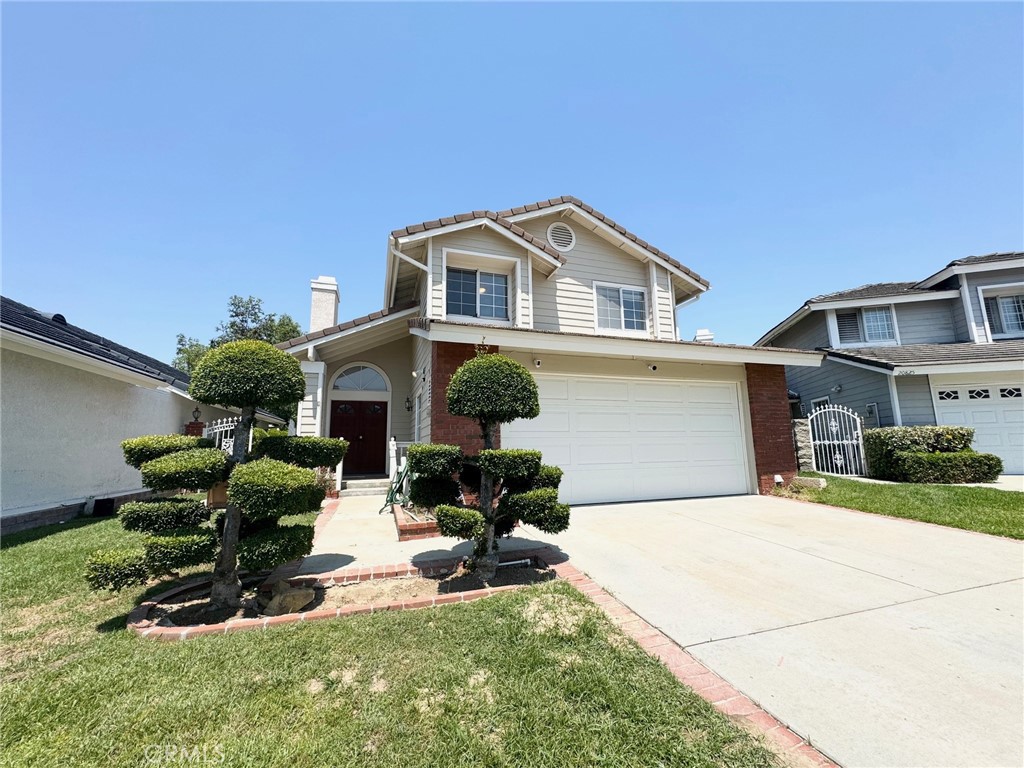 This home sit in a quiet and friendly neighborhood of Diamond Bar (or Walnut), offering 3 bedrooms, 2.5 bathrooms and 2 car garage with direct access to inside. Great curb appeal and spacious backyard that allows outdoor activities. Entering the home, you will enjoy the open space of the living room with a downstair bathroom. The kitchen offers plenty of the cabinet spaces and open to the dining area and interior family room. Upstairs has not only the master bedroom with bathroom, two bedroom and a hallway bathroom, but also a bid area of the loft for a various use. The excellent school district offers award winning high schools and middle schools. A big park (Ronald Regan Park) is nearby within walking distance. Easy access to 60/57 Freeway. Do not miss the opportunity and come see it and find out more!!