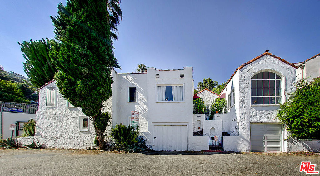 Unique opportunity to acquire 6887 Yeager Place, a two-unit (duplex) income-producing property located in the beautiful Hollywood Hills. This charming Mediterranean property with original architectural details and stunning views is nestled in a quiet enclave atop the Hollywood Hills and is comprised of two, one-bedroom / one-bathroom units. Each unit is accessible via the central courtyard, and each unit boasts hardwood floors and a laundry area. Each unit also has a detached garage. This offering is perfect for an owner/user or investor, with great value-add potential. Take advantage of the relaxing retreat-style property away from the hustle and bustle of the city life down below. The large rooftop patio boasts outstanding views of the city and the Hollywood Hills. Easy access to the 101 freeway and a short walk to Yamashiro's, the Hollywood Bowl, the Dolby Theater, Hollywood & Highland, and many Hollywood restaurants and attractions.