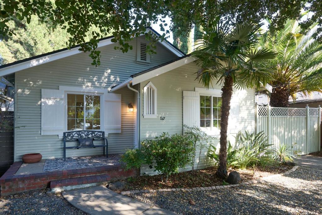 Charm Meets Convenience and Lifestyle! This beautifully and extensively remodeled home is ideally located just a short walk from vibrant Castro Street, local parks, the farmers market, Caltrain, etc. Enjoy additional square footage of a finished detached one-car garage (~177 sq. ft) perfect as a family room or office and a finished shed ideal for a home workspace or studio. Inside, a bright living room with a cozy fireplace welcomes you, while the Newly Remodeled eat-in chef's kitchen features white cabinetry, stainless steel appliances, and a central island for casual dining or entertaining. The primary bedroom offers generous closet space and direct backyard access. **Newly Updated: bathroom, dual-pane windows, central heating and A/C, plumbing, electrical panel, high power line for potential car charger, fences, automatic gate opener and a * brand-new roof * add to the home comfort and value. Laundry and storage are in the basement (extra ~60 sq. ft). The lush backyard includes mature trees and a flagstone patio ideal for outdoor dining. Additional highlights: ample tandem parking, and easy access to Hwy 85, 101, and Stevens Creek Trail. Located in the highly regarded Mountain View School District this home offers the perfect blend of space, style, and location.