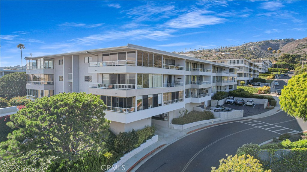 Welcome to sophisticated coastal living at its finest! This stunning 2-bedroom, 2-bathroom residence in Rancho Palos Verdes offers a unique blend of elegance and modern comfort. Additionally, the breathtaking ocean views and endless sunsets will captivate you every day. With 1,565 square feet of thoughtfully designed space, this home promises a lifestyle of luxury and ease.
The open-concept living area is adorned with new engineered-wood flooring, which is celebrated for its water resistance, and shows off a wall of windows that slide open to a private balcony. The space is illuminated by fresh recessed lighting and a newly skim-coated ceiling and complemented by new interior doors with sleek black hardware. Cozy up by the new electric fireplaces or enjoy the breeze from brand-new ceiling fans as you take in the stunning ocean vistas. The kitchen is a true showstopper, featuring custom Maplewood and Rift White Oak cabinetry, highlighted by sleek quartz countertops and breakfast bar with open shelving. All new stainless steel appliances will elevate your culinary experience including a built-in microwave drawer, 6-burner gas range, and matching stainless steel range hood. Natural light floods the bedrooms and the primary suite bathroom offers a serene retreat with dual vanities and a soaking tub. Both bathrooms have been fully upgraded with Spanish-style ceramic tile, quartz counters, and modern fixtures. Washer and dryer hookups are located inside the unit.
Enjoy the fresh ocean breeze outdoors on your balcony, with new epoxy flooring, while soaking in the stunning views. This community offers pampering amenities like a gym, pool, sauna, picnic area, and tennis court. The unit comes with two parking spaces, one in the garage and one outside, plus additional storage. Experience the perfect blend of high-end finishes, modern living, and panoramic ocean views in this Rancho Palos Verdes gem!