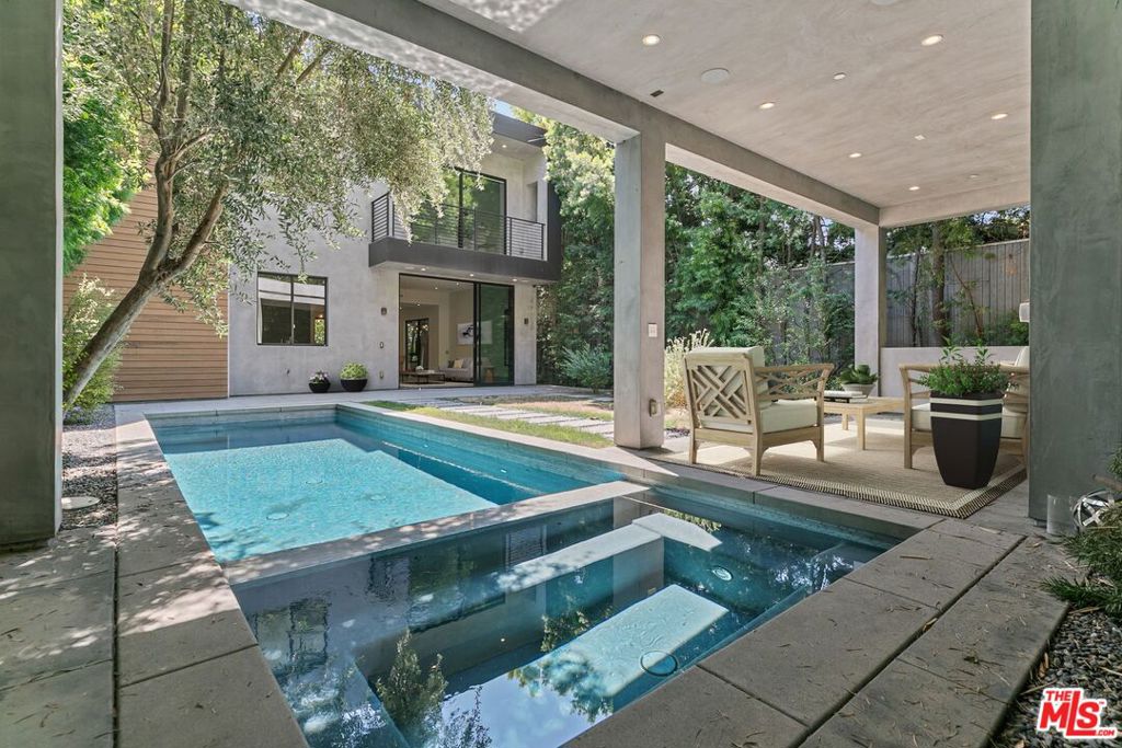 Modern home on desirable Huntley Dr in West Hollywood. Walk to all your favorite restaurants and shops with modern amenities. Large living and dining with glass doors leading to the back patio fully equipped with speakers, pool and great room for entertaining. All 3 bedrooms upstairs are en suite and lower level has two more bathrooms, one with a shower near the pool to clean off!