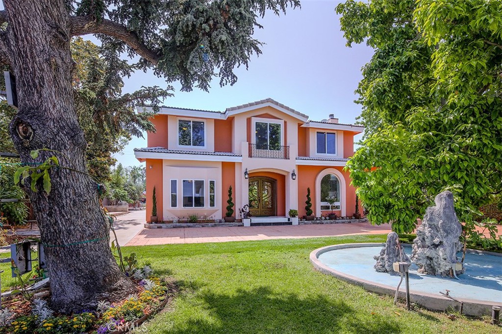 This beautiful custom built home was professionally designed and constructed by the owner in 2010. This spectacular house is peacefully located just north of Huntington Dr, with close approximate to H mart, Santa Anita Mall and Horse Race Tract in Arcadia. You enter the two story house through the newly installed automatic gate and a picturesque water fountain. You walk up to the oversized special made double door entry, there is a breathtaking cathedral high ceiling with natural lights and marbles floor welcoming you. On the ground level, there is living room, family room with fireplace, formal diming room, and office, one bedroom, a bathroom, kitchenette with plenty of storage. Four bedrooms and four baths are upstairs. The primary suite has spa tub and a balcony with gorgeous mountain view. Super floor plans with a spacious dan which optional for 7th bedroom. There is an existing garage with potential conversion into an 1,152 Sq. Ft. ADU. There are also fruit trees around the house. This is a hidden jewel house with mountain views. Must see to appreciate.