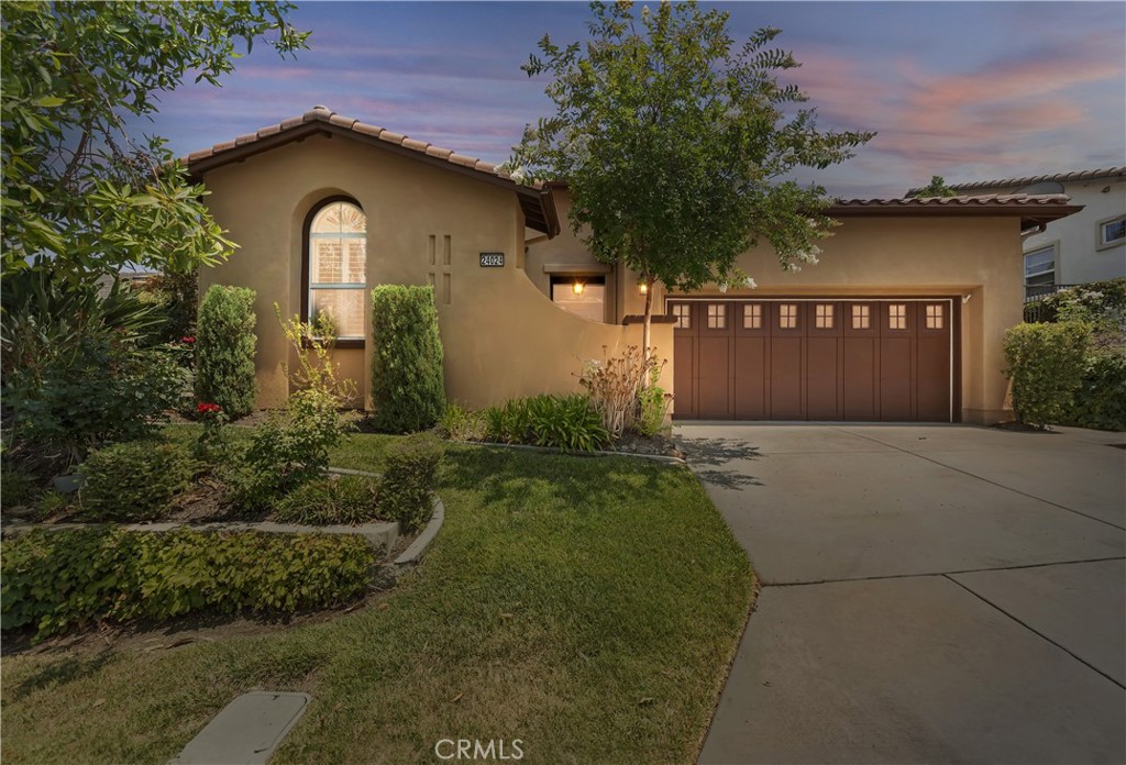 Nestled within the Southern CA's most popular Trilogy 55+ Gated Resort Like Community is this meticulously clean and maintained Tenaja model (1,758') which sports beautiful hardwood flooring and bathroom tile. Enjoy the professionally designed back yard and the flowers and bushes. The flex room has beautiful white built-in bookcases framing the backyard. The master bedroom has plantation shutter sliders which access the private rear second patio. Ensuite second bedroom. Inside laundry room, gourmet kitchen with sweeping bar stool seating to accommodate most gatherings. The HOA includes front yard maintenance! The amenities and 65+ clubs in this resort like community are amazing - something for everyone.