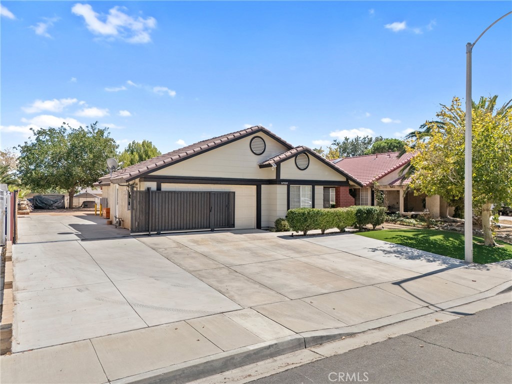 Welcome to this beautifully upgraded home, thoughtfully improved inside and out for style, comfort, and convenience. The front exterior features new copper piping, cleared drainage, synthetic turf, fresh paint, and lighting that highlights the landscaping, along with an electronic gate for easy access. The side driveway has been extended with concrete, the gate reinforced, and dual EV charging stations installed.
Inside, the home shines with fresh paint, added insulation, wood flooring in the living room, custom blinds throughout, and new fans and lighting in every room. The bathroom has been upgraded with new piping, sink connections, and modern fixtures, while all outlets have been replaced for peace of mind. A new roof, solar panels, and a recently replaced AC unit add lasting value and efficiency.
The garage has been converted into a modern JR ADU, and includes its own kitchen, bathroom, and new cabinets — perfect for extended living or income opportunities. The main home features high ceilings, granite countertops, tile and laminate flooring, a walk-in closet in the primary suite, and a smart thermostat with central AC and heating. The oversized backyard, storage shed, and RV access provide plenty of space and flexibility for future plans.
Conveniently located near Antelope Valley Mall, Amargosa Commons, Palmdale International Shopping Mall, and close to local parks, this home offers both everyday ease and outdoor recreation, with quick access to the 14 Freeway for commuting.