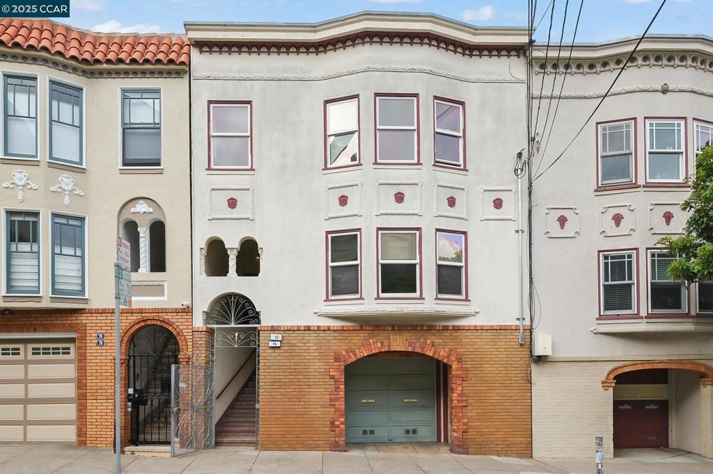 Welcome to 72-74 Cumberland Street, a rare offering in one of San Francisco‘s most vibrant neighborhoods. On the market for the first time in 80 years, the timing is perfect for a “live-and-rent” owner occupant, investor or developer. A mere half block from your front door is the amazing 16 acre Dolores Park featuring a massive children’s playground, sport courts, dog play area and of course picnicking/sunbathing in its sunny & warm microclimate. This fabulous 1932 Mission Dolores Duplex is 3,110 square feet offering the perfect blend of classic charm, solid fundamentals and upside potential. The attached 2 car garage, basement bonus rooms, level backyard with garden all add to the wonderful appeal of this 3 story gem. Both 2 bedroom 1 bath units have abundant natural light, period details and iconic San Francisco views. Additional highlights include rich hardwood floors, arched doorways, spacious living room with fireplace, Bay Window with window seat, formal dining room, bright kitchen with breakfast room and built-in buffet plus so much more. Proximity to multiple thriving neighborhoods, transit, dining and walkable amenities make this property a true Standout!
