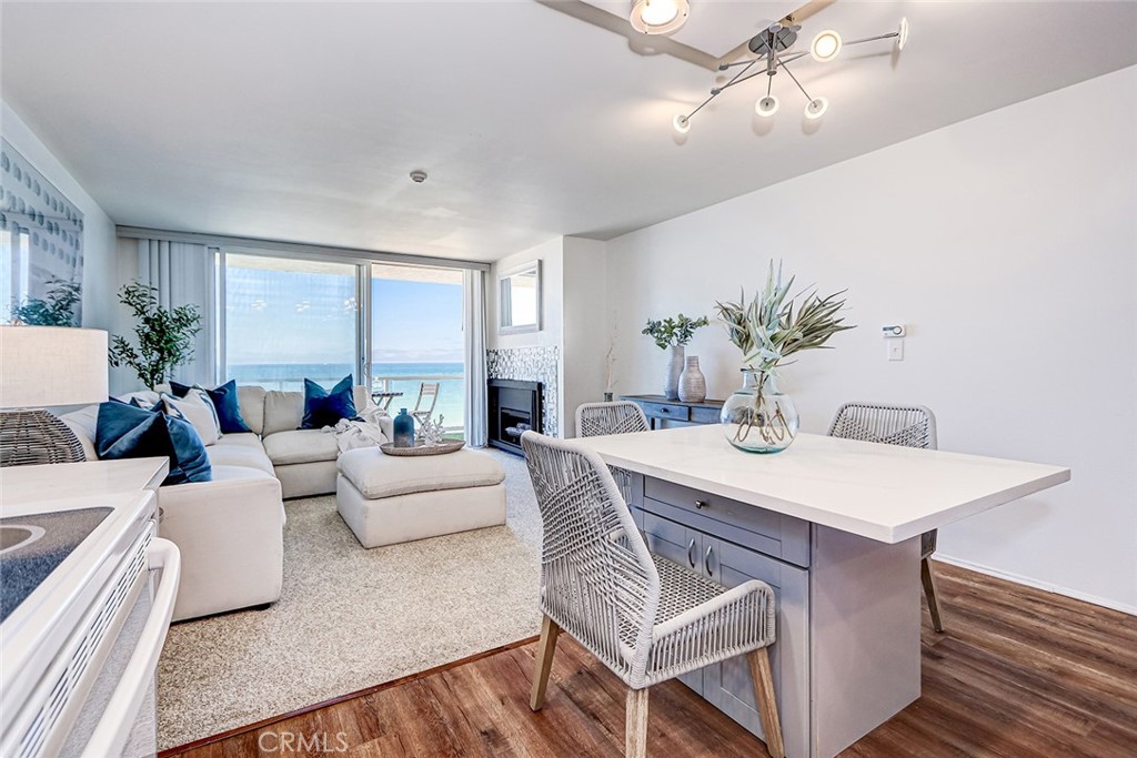 Perfectly positioned on the second floor of the coveted ocean side of Esplanade, this panoramic view oceanfront condo is the perfect blend of coastal charm and contemporary design. Featuring unobstructed white water views from Catalina to Malibu, this inviting home has been thoughtfully remodeled throughout. The kitchen and living room have been opened up allowing for panoramic views from multiple areas of the unit. The kitchen has been upgraded with stylish countertops, newer appliances, and a modern sink with a complementary faucet. The bathroom was fully remodeled, featuring a refreshed shower design that balances functionality with a clean, modern aesthetic. An upgraded sliding door opens from the living area to a private patio, where peaceful ocean views create the perfect setting for morning coffee or evening relaxation. One of the most desirable features is the direct beach access along the iconic Esplanade, offering a front-row experience of the Southern California coastline while also offering the privacy on a second floor location. The property is conveniently located near local shops, grocery stores, and the vibrant Riviera Village, home to boutique shops, cafés, and popular dining spots. This home presents an opportunity to own an attractively updated ocean front condominium in one of Redondo Beach’s most desirable coastal communities.