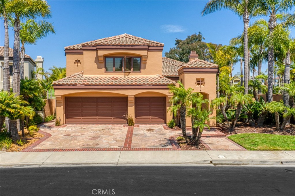 Welcome to the standout coastal retreat in the prestigious gated community of Seacliff Estates II! This stunning 5-bedroom, 4.5-bath home offers 3,313 sq ft of luxurious living space on a beautifully landscaped 7,000 sq ft oversized lot, one of the largest in the community, just moments from the beach. Step inside to soaring ceilings, abundant natural light, and elegant architectural details that create a bright, airy ambiance. The formal living room features large picture windows, a cozy fireplace, and refined finishes, seamlessly flowing into the sophisticated dining area—perfect for hosting. The spacious chef’s kitchen opens to a comfortable family room equipped with another fireplace, ideal for intimate gatherings with loved ones. Upstairs, the primary suite is the crown jewel—an expansive private retreat with panoramic views of the lush fairways that also provides a generous sitting area with a private fireplace connecting the bed and bath areas. The spa-inspired ensuite offers dual vanities, a soaking tub, and a walk-in shower complete with a beautiful skylight. Additional bedrooms are generously sized, each designed with versatility for guests, office, or gym. Outdoors, the charming courtyard, built in bbq, and landscaped patio create a perfect backdrop for al fresco dining or relaxing in privacy. The yard uniquely features a spacious gazebo, customized jacuzzi which can be included if desired, and boasts the most palm trees in the community. Outside, your private courtyard and lushly landscaped patio provide a tranquil escape with multiple areas for dining, lounging, and entertaining under the California sun. The recently remodeled three-car garage and expansive driveway offer convenience and curb appeal, framed by mature palms and tropical greenery.