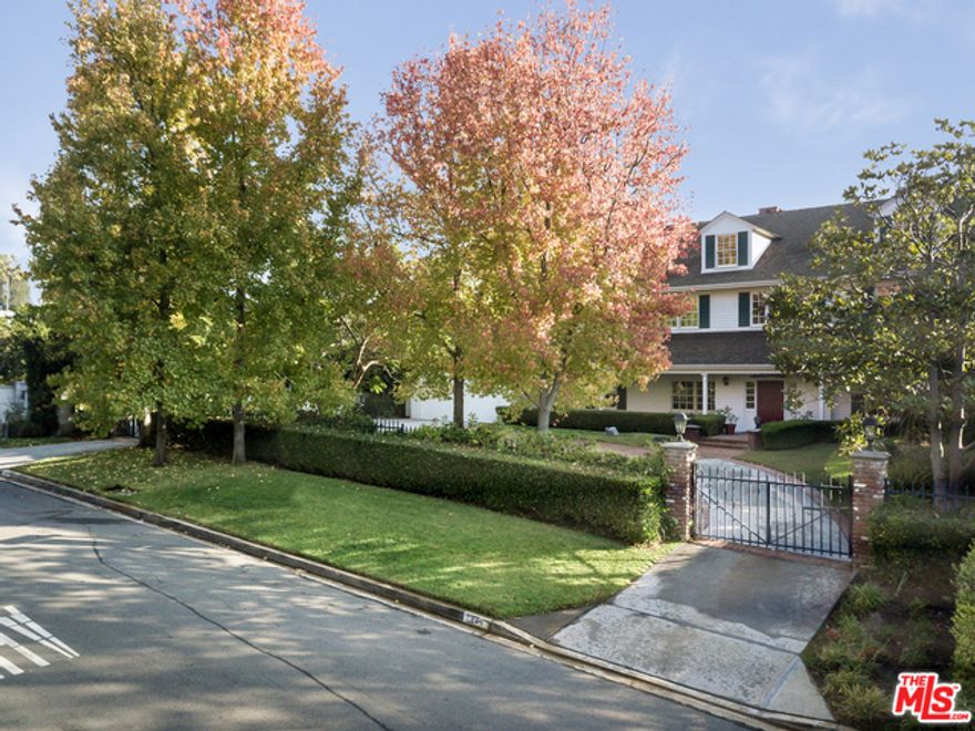 Rare offering of East Coast elegance on a street-to-street lot in prime Brentwood Park.  Lovely as-is or take advantage of the "good bones", including ceiling heights, sqft, and layout, to remodel into your dream home in this spectacular location.  Updated kitchen cradled by a dining room, sunroom & living room with high&#195;&#8218;&#194;&#160;ceilings and grand fireplace.&#195;&#8218;&#194;&#160;A library and wood-paneled study on the first floor cozy up to a rich, movie-set-like foyer with spiral staircase at the estate's entrance.&#195;&#8218;&#194;&#160; Two bedrooms on the 1st floor, plus five additional bedrooms upstairs including master with walk-in closet & large bathroom. There is a wine cellar/basement that could be converted into a state-of-the-art recording studio, plus upstairs attic has been converted into bonus space. Gated front yard with motor court, private backyard with pool/spa, entertainment decks and large grassy yard.