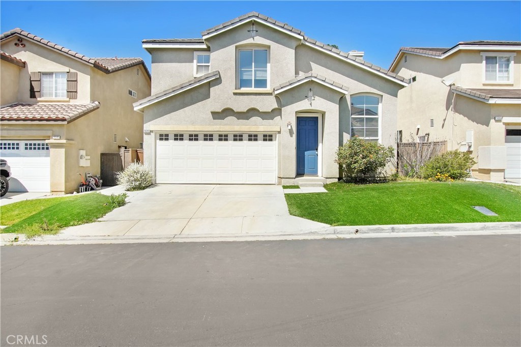 Welcome to an exceptional opportunity in Santa Clarita! This beautiful residence, boasting 3 bedrooms and 2.5 bathrooms, offers ample space for comfortable living. As you step inside, recessed lighting throughout creates a warm and inviting ambiance, complementing the airy kitchen—a chef's dream with its blue and white shaker cabinets, quartz countertops, and backsplash. Equipped with stainless steel appliances, including a farm sink and gas range, the kitchen seamlessly blends style with functionality. But there's more to love about this home. The main floor features a modern half bath with a floating vanity, enhanced by sleek OLED mirrors. Nest central air and heat ensure year-round comfort, while the newly painted interior adds a fresh touch to the home's aesthetic. Upstairs, the primary bedroom retreat awaits, complete with a ceiling fan, walk-in closet, and a beautifully tiled en-suite bathroom featuring a dual sink modern vanity and multi-jet shower system. Convenience is elevated with upstairs laundry, making chores a breeze. Additionally, a home office nook provides the perfect space for productivity or relaxation. Throughout the upstairs, elegant cherry wood flooring graces the hallways and bedrooms, adding warmth and character to every space. Artificial turf in both the front and back yard to enjoy a lush, green landscape year-round with minimal maintenance. Embrace the essence of modern living and make this exquisite residence your new home sweet home.