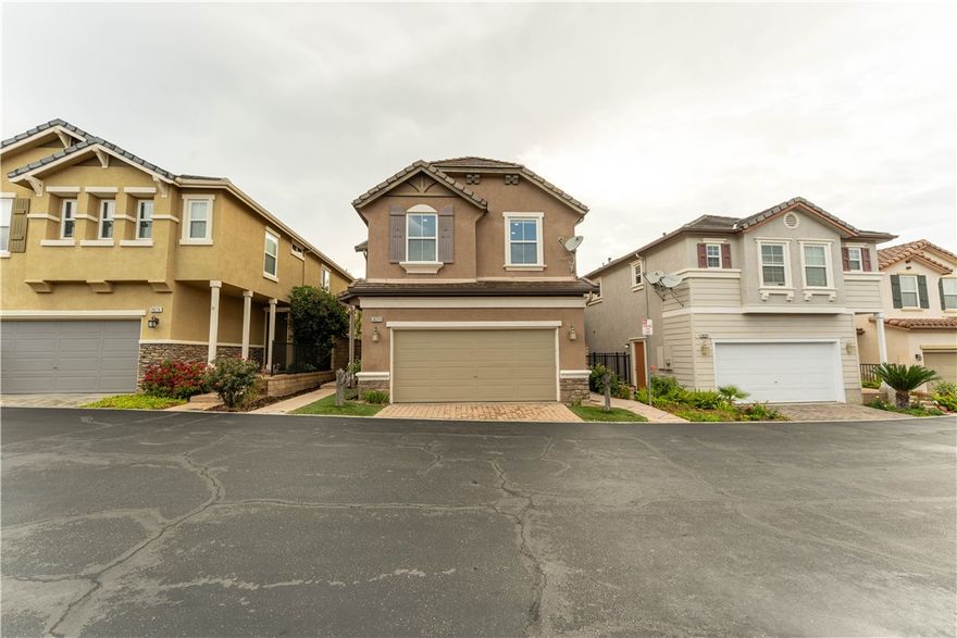 Welcome to your dream home nestled in the prime location of Santa Clarita Valley! This immaculate residence exudes a sense of comfort and style, offering a delightful retreat for you and your family. Boasting a versatile layout, the fourth bedroom area has been thoughtfully designed as a spacious open loft, perfect for various uses. Step inside and be greeted by gleaming hardwood floors that flow seamlessly throughout the main level and into the loft and primary bedroom, creating a cozy ambiance. The bright kitchen, complete with a pantry and breakfast bar, opens up to both the dining area and the backyard, ideal for hosting gatherings and entertaining guests. Recessed lighting throughout enhances the open concept, providing a modern touch. This home boasts numerous upgrades, including chair rails, beadboard accents, tall baseboards, hardwood and tile floors, as well as PAID OFF SOLAR SYSTEM (Worth over $20K). Outside, the stamped concrete and artificial grass in the backyard and front yard create a low maintenance yet charming outdoor space. Additionally, the HOA amenities include a pool, spa, showers, and a tot lot, providing endless opportunities for recreation and leisure.