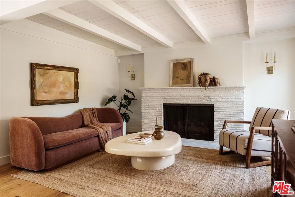 Enchanting Adams Hill Modern Spanish, restored and remodeled, with thoughtful and chic details throughout. Situated on a gentle knoll, on a quiet street, with lush green mountain views toward Glendale, the hills and beyond, this 4 bedroom 2 bath charmer, with lovely front and back yard space, will captivate you from the moment you step on the property. The architectural details speak to another age, when the design of homes were carefully considered, imbued with light and grace, and life was easy. This home exudes these qualities and brings forth a lovely picture perfect lifestyle for its inhabitants. From the arched passageways, to the wood floors, to the meticulously designed gourmet kitchen (with built in banquette and ample pantry) to the wonderful primary bedroom suite with luxurious bathroom and dreamy walk in closet, and outside to the lovely grassy yard, garden beds, dining deck and seating area with fireplace. Walkable to Palmer Park and playground, Adams Hill mini park, Kafn coffee, Little Ripper Cafe and under 10 mins drive to Glassell Park (LA Homefarm, Bub and Grandmas) Atwater Village, Highland Park and Eagle Rock. Rumor has it, Erewhon will be coming to the neighborhood this year - a 9 minute drive from the house! SO much to love. Truly a slice of heaven.