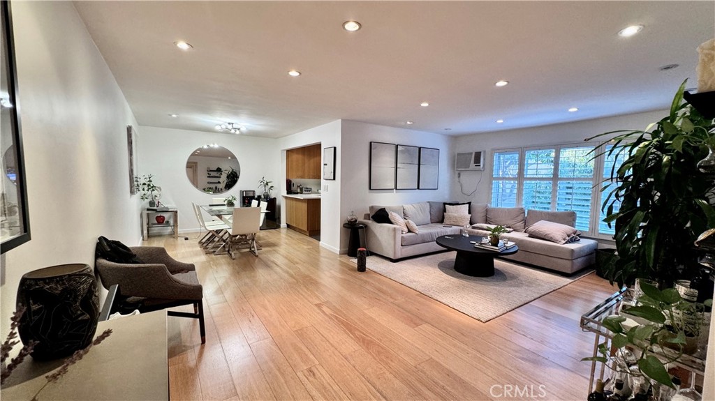 Welcome to your West Hollywood dream condo, ideally situated in the heart of the vibrant Design District. This beautifully updated second-floor unit features one bedroom, one bathroom, and nearly 900 square feet of thoughtfully designed living space. Nestled in an impeccably maintained Mid-Century building, the condo offers a perfect blend of modern comfort and timeless style. Enjoy an unbeatable location, just steps from Urth Caffé, with world-class dining, high-end shopping, and top nightlife destinations nearby. Inside, the north-facing layout floods the home with natural light while ensuring privacy. The spacious floor plan features dedicated living and dining areas, along with additional space for a home office—ideal for today’s versatile lifestyle. Recently remodeled, the home features elegant finishes throughout, including wide-plank hardwood floors, recessed lighting, and a sleek kitchen adorned with Carrara marble countertops. The stunning bathroom continues the theme with Carrara marble surfaces, a separate soaking tub, and a walk-in shower. Additional highlights include in-unit laundry for added convenience and a dedicated gated parking space. Community amenities include a stylish lobby, a resort-style pool and lounge area, and low HOA dues, making this an attractive option for both homeowners and investors. Whether you're looking for a chic urban retreat or a smart rental property, this West Hollywood gem checks every box. Don’t miss your chance to own in one of the city’s most coveted neighborhoods!
