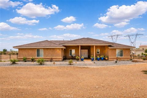 Photo of 6797 Blue Rose Ln, Oak Hills, CA 92344 (MLS # HD26007813)