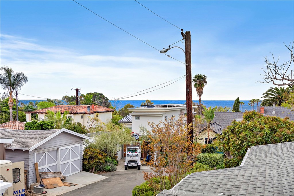 Experience the ultimate in coastal living with this beautifully updated fully furnished cottage, complete with a white picket fence, located on a quiet street in the heart of Laguna Village. Enjoy stunning ocean views from multiple outdoor patios, perfect for taking in the ocean breeze. This home features a cherry cabinetry and granite countertop kitchen, with a door leading to one of several outdoor patios. With one bedroom and full bathroom downstairs, this home can live like a single story. There are fireplaces in the living room and den as well as the upstairs bedroom suite. Step outside to a wrap-around yard with multiple gathering areas, making this truly an indoor-outdoor home. The upstairs bedroom suite features a second full bathroom, as well as a large ocean view balcony, the perfect spot to enjoy your morning coffee or take in an evening sunset. Experience small town Laguna Beach living at its very best! This property is just a short distance from the beach and all of the shops, restaurants, and art galleries. Book your stay now and experience the ultimate in luxury and convenience in this stunning cottage, where every detail has been carefully considered to provide a comfortable and unforgettable stay.