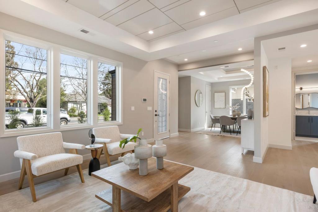 A new, beautifully crafted home in a sought after neighborhood on the west side of Redwood City just two blocks from Red Morton Park. Eco-friendly & sustainable design includes all-electric features, fully owned solar power & alarm system plus low-maintenance landscaping. Open-concept central living area is bathed in natural light & features formal living & dining rooms, engineered white oak floors spanning both levels, unique ceilings, wall details & dazzling pendant lighting. The kitchen showcases custom cabinetry in contrasting hues, marble-style quartz countertops, & top-of-the-line Thermador appliances while the spacious family room opens to the rear yard through sliding glass doors for effortless indoor-outdoor living & entertaining. Smart home systems provide simple control of HVAC, Garage Door, Video Doorbell, Solar, Landscape Irrigation & the hard-wired home alarm on all operable windows & doors. Additional highlights include linear electric fireplace in the living room, pre-wiring for security cameras, distributed sound speakers, including family room 5.1 surround sound and detached two-car garage with epoxy flooring. Easy access to sports amenities, the future YMCA, innovative Magical Bridge Playground and Red Morton Park provide recreational options for all ages.