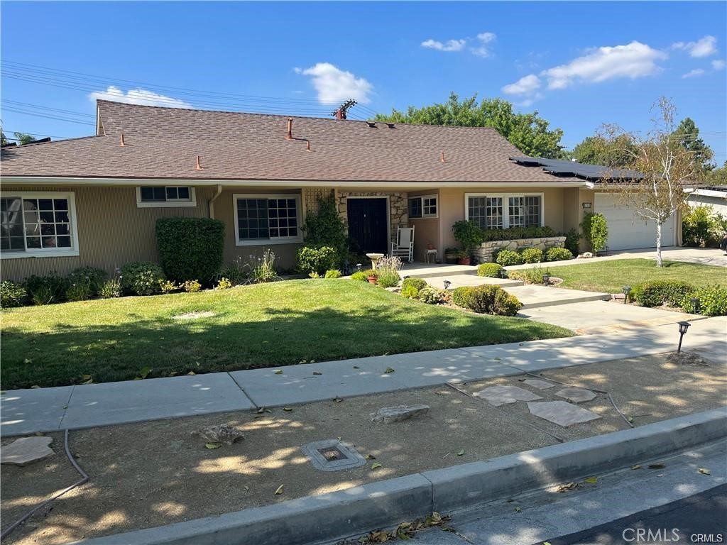 Gorgeous 1 story Woodland West Pool home in Prime Woodland Hills. This tastefully remodeled 4 bedroom, 2 1/2 bathroom home sits on a large lot with park-like backyard, and expansive pool. The open floor plan includes a totally remodeled eat-in kitchen with stainless steel appliances, custom cabinets, granite counters and a large breakfast bar with ample seating. The fireplace serves as a partition between the dining room/family room and living room. The guest half bath is conveniently located off of the entry hallway. There are 3 bedrooms and large master suite with beautiful custom tile and stone. Sliding doors from the living spaces open out to the covered brick patio and spacious back yard and pristine pool. Other features include fresh paint, wood-like floors throughout and sleek fans in all the bedrooms. Washer, dryer and 2 refrigerators are included. ( 2 car garage with room for 2 additional cars in the driveway.) Close to The Village, Westfield Shopping Mall & Movie Theatres, Calabasas Commons & Farmer's market, freeways and blue ribbon schools including El Camino Charter High School and Hale Charter Middle School.