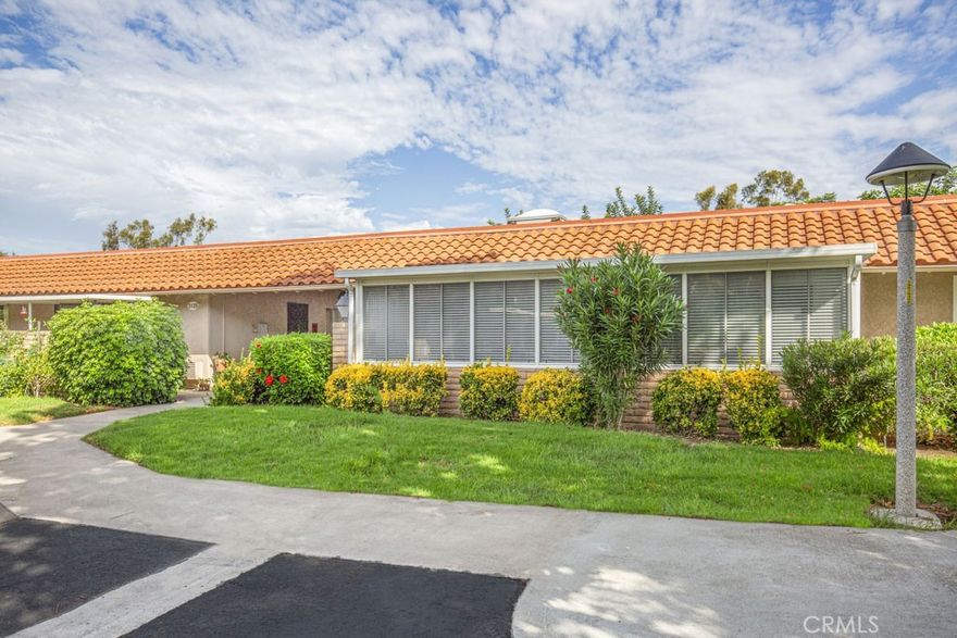 Laguna Woods Village is a gated community with 24 -hour security. This unit is a popular " CASA VISTA" model. it has no stairs to climb, close to assigned parking space. It has beautiful mountain view from the balcony. The primary bedroom features a large walk-in closet and ensuite bath. The guest bedroom opens directly to the balcony. The hall bath provides a convenient step-in shower and a stacked washer and dryer, which is a coveted 

feature in this community. Each bedroom and the dining room has ceiling fan. Wall AC units in the primary bedroom and living room. The sliding doors in the living room open to an extra-long balcony that is perfect for morning coffee, afternoon reading, and barbecuing while you enjoy the scenery. It is also a fantastic location between gates 7 and 8. Washer/Dryer (put in service in January 2023) Refrigerator and dishwasher are included. It has a brand-new electrical  water heater. The Association dues also pay for water, sewer, trash and cable TV. Laguna Woods Village has over 2100 acres of rolling hills in a desirable South Orange County. It has tow professional Golf Courses, beautiful restaurant and bar that overlooks the Golf Course, 5 pools including a lap pool. Community TV Channel with exclusive programs, 2 Community Gardens, 7 unique clubhouses, an 814-seat Performing Art Theatre. Professional Workshops include Jewelry making, Slip Casting, Woodworking, Ceramics, Photography and more...Equestrian Center has 38 Stables for horse boarding, riding ring & guided trails rides. Transportation with fixed routes & on demand. It is close to Laguna Beach, grocery stores, shopping mall, pharmacies and Hospital...