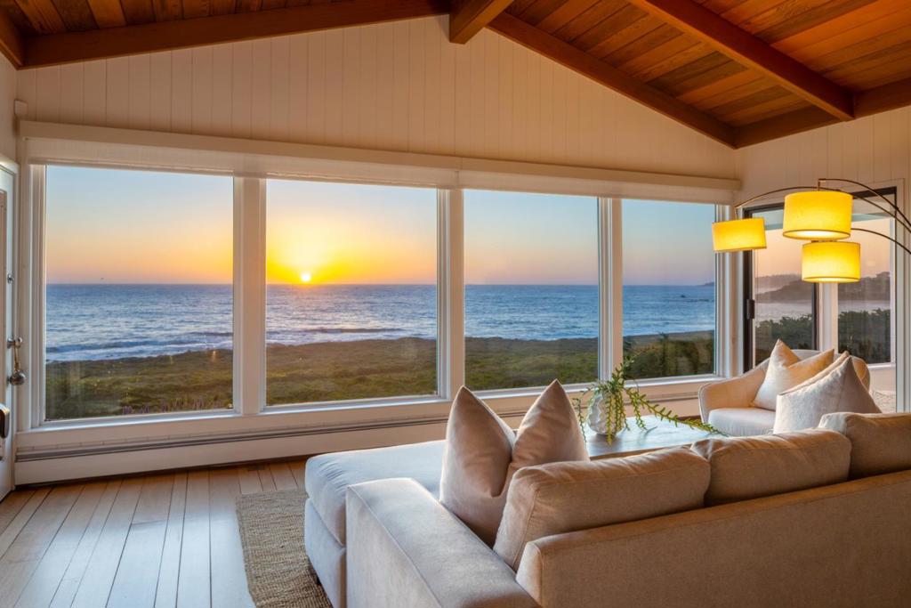Welcome to 2715 Ribera Road in the coveted Carmel Meadows neighborhood-a stunning oceanfront retreat that seamlessly blends comfort, elegance & breathtaking views. This chic beach house offers unparalleled coastal living with sweeping panoramas from Point Lobos to Carmel Point on all levels. The main level features a spacious ocean-view kitchen, dining room & formal living room with floor-to-ceiling windows that frame the spectacular seascape. The primary suite features ocean views and attached sunroom with two additional guest bedrooms & 1.5 baths on the main level. The lower level has a cozy TV/game room, access to the outdoor hot tub & two more guest bedrooms, bathroom & office nook. Outside, enjoy a large scenic deck with unobstructed ocean views & ample space for al fresco dining. The spacious 3-car garage & circular driveway provide plenty of parking. The property offers a direct path to Ribera Beach & trail leading to Carmel River Beach & truly embodies the ultimate coastal lifestyle.