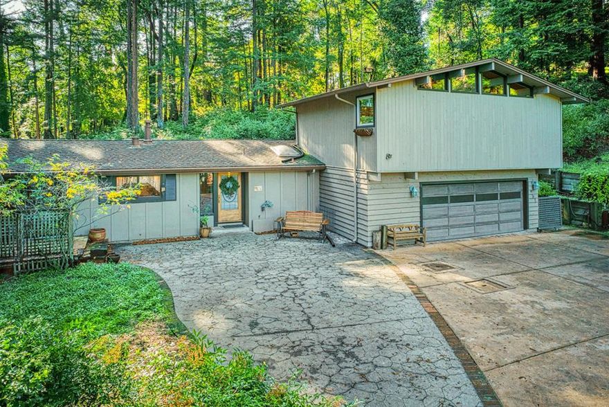 Tranquil setting not far from downtown Felton sits this beautiful home that provides privacy, and plenty of living space! As you drive up to this home, you are welcomed with plenty of parking, and natural beauty! As you enter you are welcomed with vaulted wood pine ceilings, with large beams, and lots of natural light. This home features hardwood floors, Pella windows and doors, built-in book shelves, and a gorgeous Vermont castings gas stove for heat. The kitchen has granite counter tops, gas cooktop, plenty of storage, and the kitchen window looks out at trees, and natural beauty. Two bedrooms downstairs, two full bathrooms, and laundry are downstairs for convenience. The gorgeous primary suite upstairs is spacious, and the views of the tress and mountains make it a tranquil living space. This home is cozy and warm, yet has lots of living space that offers different areas to relax and enjoy. You will love this home and property, all within walking distance to downtown Felton for an evening out, or easy access to amenities. Come check it out!