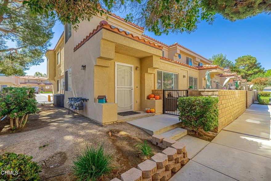 Welcome to the highly desirable gated community of Marbella Villa Townhomes, where comfort and convenience meet! This beautiful end-unit condo offers 3 bedrooms and 2.5 bathrooms, including a spacious master suite with a private retreat/office space, his and her closets, and a stunningly upgraded bathroom with an oversized shower. The open and inviting floor plan features a family room with a cozy fireplace, tile flooring, a stylish kitchen with granite countertops, stainless steel appliances, and a charming garden window. All bedrooms are located upstairs, with upgraded bathrooms and modern touches throughout. Enjoy a private front patio, direct access 2-car garage plus guest parking, and a prime location within the community. Marbella Villas also offers resort-style amenities including a sparkling pool & spa, fitness center, tennis courts, recreation room, and HOA coverage for water, trash, roof, and stucco maintenance. Ideally located near AV College and just minutes from the freeway, this is Lancaster living at its best!