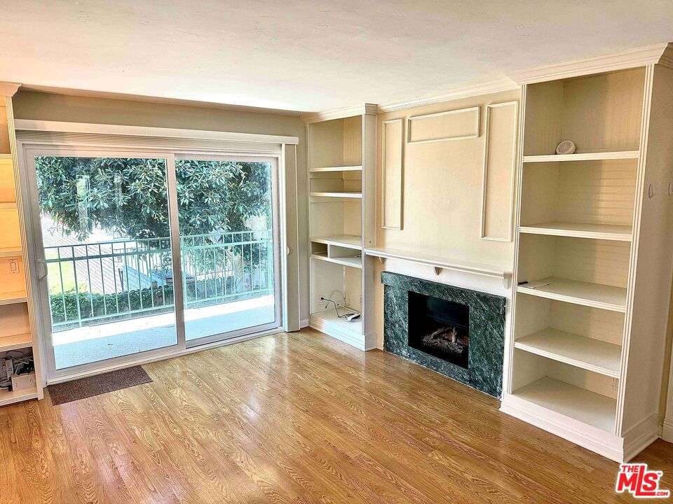 Nestled in the Malibu Gardens community, this upstairs corner unit overlooking the garden and pool embodies the casual California lifestyle. With 2 bedrooms and 2 bathrooms, it features a galley kitchen, cozy fireplace, built-in living room cabinets, a spacious walk-in closet, upgraded windows, and in-unit laundry. The balcony, accessible from both the living area and primary bedroom, offers picturesque views of the lush greenery and pool. Perfectly situated away from PCH in a sought-after Malibu neighborhood, just moments away from Zuma beach, shopping, and more. The unit also includes two covered side-by-side parking spaces, a community pool, and hot tub, enhancing your coastal living experience