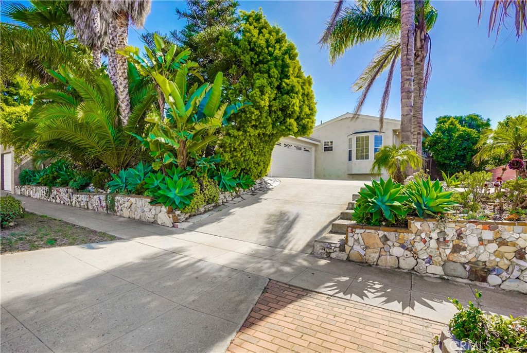 Welcome home to this beautiful beach bungalow located just a few blocks from the bluffs, in the heart of the Palisades area. This home offers quintessential California living featuring 3 bedrooms, 1.5 bathrooms and approximately 1,000 sq. ft. of living space. The spacious floorplan offers a remodeled kitchen with dishwasher, range, microwave and refrigerator, with added breakfast island, plus a nice sized living room with fireplace. Highlights include beautiful wood floors, security doors, tons of privacy, plus an attached garage with laundry for added convenience. Step outside to a lush oasis with mature fruit trees offering tons of privacy, patio space for entertaining, plus sprawling grass lawn with work shed! This home has it all. Tenant pays all utilities except for the gardener. Close proximity to freeway access, Cabrillo Beach, Cabrillo Marina, Fort McArthur, the upcoming West Harbor Renovation & more.