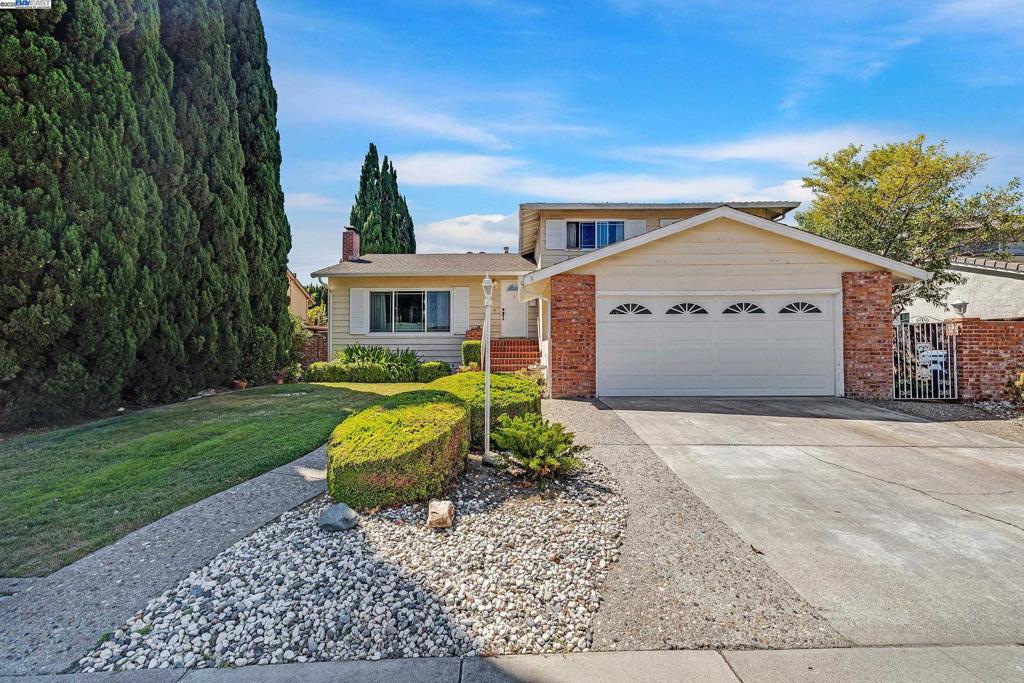 “Open House” 8/16 & 8/17 from 1:00 pm until 4:00 pm ~ This elegant home has an abundance of natural light, bright and open tri-level floor plan offering a stylish living environment and located in the desirable Westridge District ~ This spacious 2,160 sq. ft. home features four bedrooms ~ three bathrooms ~ wooden stair case leading from entry way to bottom & upper floors ~ large A.E.K. with a built-in tiled alcove with burners and grill, tiled floor, wood cabinetry & ceiling fan, ~ Step-down living room with hardwood floor, fireplace with wood façade & mantle ~ step-up formal dining with hardwood flooring & view of large rear yard ~ lower level den with wet bar & access to rear yard ~ master bedroom with hardwood floors, his & hers closets, modified quartz vanity, step-down shower with tiled walls & sliding doors leading to private patio ~ second floor bath with tub/shower combo, tiled floor ~ down stairs bath with stall shower, single sink cultured marble vanity and tiled floor ~ But wait, there’s more! ~ Dual paned windows & doors throughout ~ two-car garage w/storage shelves, access to side yard, laundry facilities ~ cement patio deck in rear yard ~ Large 8,256 sq. ft. lot ~ Conveniently located to top rated schools, shopping, restaurants and a super location for commuting