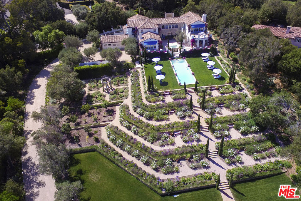 This classic Montecito estate property, built in 1930 and fully restored in 2020, by the renowned architects Sorrell & Sorrell, is for those who appreciate old world Mediterranean craftsmanship and beauty. It is located in the heart of Montecito's exclusive (golden quadrangle) and on one of its most prestigious streets. The gated property offers privacy and seclusion, expansive and unobstructed tree top, mountain and ocean views. It's a pleasant stroll to the Upper Village and the San Ysidro Inn. It's a short ride to the Lower Village, Butterfly Beach, the Rosewood Miramar Hotel and beach clubs. The architectural design and materials of this country home, combined with the regal gardens and stunning views, give one the feeling of being in the hills of the French Riviera. The villa contains five bedrooms plus maid's quarters, seven full baths, three fireplaces, two bars, a billiards room, media room, gym, wine cellar, and a six-zone Sonos music system. It incorporates the highest quality appliances and an eclectic mix of custom furniture, antiques, quality bedding and original art. The master suite enjoys his and her bathrooms and closets. The grounds of the property encompass a stone terrace and sun porch that offer ocean and mountain views, three fountains, a pool and Jacuzzi. The Provencal gardens include a rose garden with gazebo, fruit and nut trees, vegetable/herb gardens, a lower sitting area, a quaint pond, and a chicken coop that produces fresh eggs. The property has a three-car garage, parking for another nine cars, an upper and lower gate which are all on 2.2 prime acres. Most of all, it is the feeling of beauty, abundance and peace that the mature vegetation, expansive forever views, exquisite gardens and architecture that gives the estate its uniqueness and charm. This is truly a slice of heaven that must be seen to be fully appreciated.