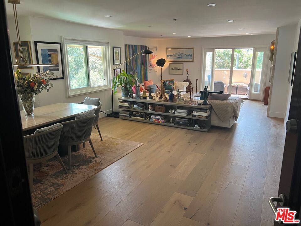 Welcome home to this fully renovated and beautifully furnished, single-level 2-bedroom, 2-bath condo, offering comfort, style, and convenience in one of Pasadena's most vibrant neighborhoods. Ideally located near The Commons and surrounded by an array of shops, restaurants, and cafes just moments away, this top-floor, corner unit residence offers a connected lifestyle in a peaceful setting. Every inch of this home has been designer-done, featuring stunning new wide-plank oak floors, custom lighting, and elevated finishes throughout. The airy layout includes a beautifully redesigned stone fireplace surround with elegant sconces at the center of the living room, and three private balconies - ideal for morning coffee or unwinding at sunset. The kitchen has been lovingly renovated with gorgeous quartz countertops with light gray veining, custom cabinetry, and stainless steel appliances - blending timeless style with everyday function. Both bathrooms have also been thoughtfully updated with high-end finishes and modern details. The spacious primary suite and second bedroom each offer generous closets, while the in-unit laundry closet features a stacked LG washer/dryer for added convenience. Additional highlights include two dedicated underground parking spaces in a gated underground garage. Set within a lush, serene community with beautifully maintained grounds, this top-floor gem is an ideal full-time residence or the perfect Pasadena pied-a-terre.