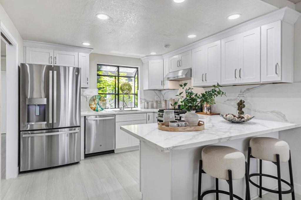 Beautifully Upgraded Home in Prime Location! Dont miss this stunning 2,196 sq. ft. residence, ideally situated in a highly sought-after community near the CampbellLos Gatos border. Recently upgraded throughout, this end-unit townhouse combines modern elegance with everyday comfort. The brand-new gourmet kitchen features sleek stainless steel appliances, a breakfast bar, and opens seamlessly into a cozy family room with a fireplaceperfect for both entertaining and relaxing. The oversized primary suite offers vaulted ceilings, a new double-sink vanity, and generous closet space. A spacious top-level loft with high ceilings and a wet bar provides flexible use as a fourth bedroom, home office, or additional living area. Additional highlights include a large two-car side-by-side garage, central heating and A/C, and indoor laundry. The well-maintained community offers a sparkling pool and ample guest parking. Conveniently located near major freeways in a quiet neighborhood, this is a rare opportunity to own a beautifully updated corner-lot home in one of the areas most desirable locations.