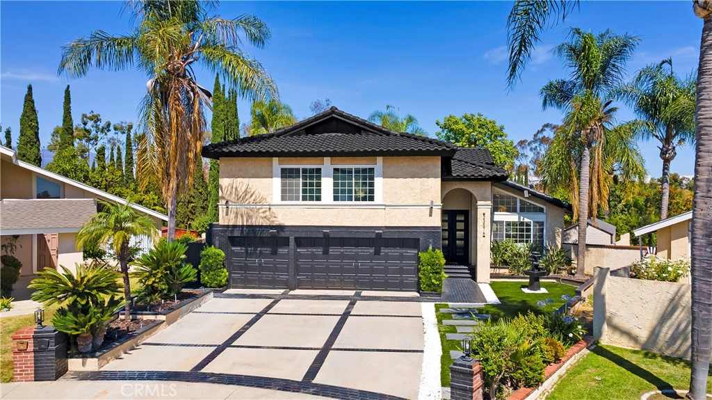 Welcome to your dream home! Nestled on a generous 13,000+ sq ft lot, this open concept residence with a pool & spa offers a rare combination of spacious luxury, modern upgrades, and resort-style living. Featuring 4 bedrooms—including two expansive master suites—and 3.5 beautifully updated bathrooms, this home is thoughtfully designed to accommodate both families and entertainers alike. Upon entry, you are greeted by white marble flooring throughout the main level, a striking black marble TV wall with a built-in electric fireplace that adds contemporary elegance to the main living space. Step inside a chef’s dream kitchen boasting high-end Dacor appliances, push-to-open custom cabinets with pull-out drawers, accent lighting, and an extra-large quartz stone island, providing both style and function. Enjoy additional luxury touches including a modern wine bar under the staircase, water-resistant laminate upstairs, and recessed ceiling lights that create a bright and welcoming ambiance in every corner of this home. The oversized glass sliding doors lead to your private backyard oasis, complete with lush tropical landscaping, swaying palm trees, a spacious swimming pool with a tranquil waterfall, and a relaxing jacuzzi. The expansive yard offers incredible versatility, with ample room to add a pickleball court, basketball court, or even build an ADU—ideal for multigenerational living or investment purposes.The front yard is fully remodeled with brand new turf, decorative white stones, and a water feature, ensuring beautiful curb appeal year-round. Don’t miss this rare opportunity to own a modern, resort-style home with endless potential!