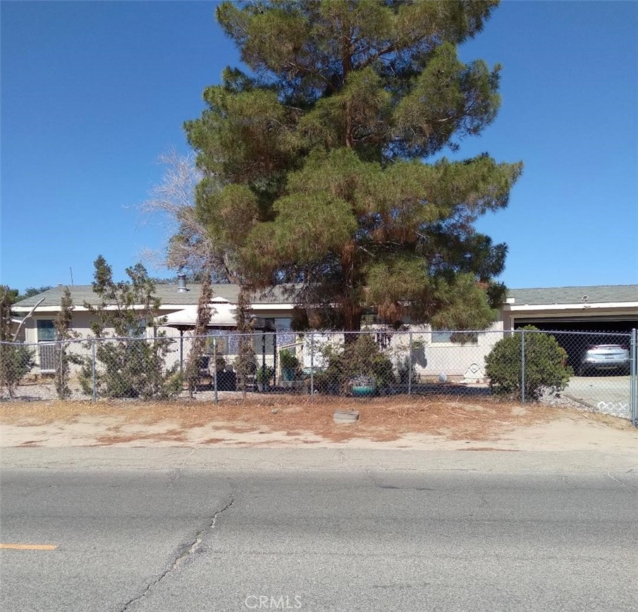 Amazing new listing in Littlerock under $400,000. This 3 bedroom, 2 bath home on a generous 13,000 + lot with room for your animals, gardening or hobbies. It's located in a pleasant rural setting on a quiet paved road with a forever mountain and desert view. Upon entering the home, you will find the open concept floorplan that features a sunny kitchen, an adjacent dining area and a living room with a cozy fireplace for those chilly winter evenings. The living area separates the primary suite from the other bedrooms and convenient interior laundry room. The attached covered patio offers a perfect spot for your morning coffee and your evening refreshment or for just enjoying the peace and quiet. Adjacent to the covered patio is an extra bonus room to accommodate your needs: man cave, she shed, artist studio, exercise room, game room or guest room. The property is completely fenced and gated with a septic system recently installed in June, 2025. Inside the gates is a 2 car garage and ample parking on the paved driveway for your vehicles, RV's and other recreational toys. This property is a great affordable property for those looking to get out of the city environment and enjoy the great outdoors.