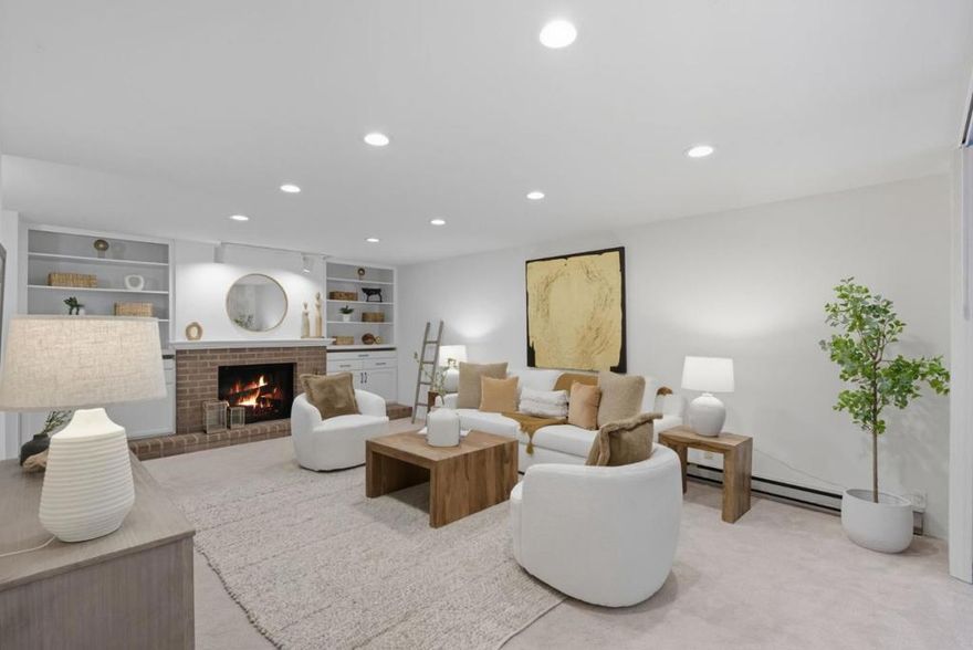Freshly painted and move-in ready, this spacious ground-floor residence offers high-quality updates in a peaceful, tree-studded community. The remodeled kitchen features maple cabinets, quartz Carrara counters, a full tile backsplash, and stainless steel appliances including a smooth-top stove, microwave, dishwasher, and refrigerator. Porcelanosa gray-tone wood-look floors and recessed lighting flow throughout. The inviting living room highlights a wood-burning fireplace, custom white cabinetry, and a slider to the private fenced yard, while the dining area also opens to the outdoors for seamless entertaining. The bathroom showcases a double-sink maple vanity with quartz counter and Porcelanosa tile. A full-size washer/dryer, storage room, and landscaped patio add convenience. Includes one garage space and a parking pass. Just steps to the pool and approximately 1.5 miles to Google with easy access to major tech hubs.