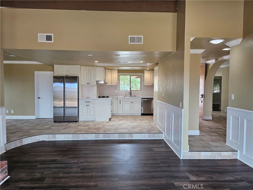 Remodeled home with beautiful mountain views in great neighborhood!  4 large bedrooms, 2 bathrooms in house, brand new kitchen and appliances, hall bathroom all brand new, new floors throughout.  open kitchen, dining and sunken living room.  Large yard, lots of hard surface.  Huge driveway plus 2 car garage with direct access.  Large side yard for potential RV parking plus additional bathroom directly accessible from side yard. Solar to save on energy costs.