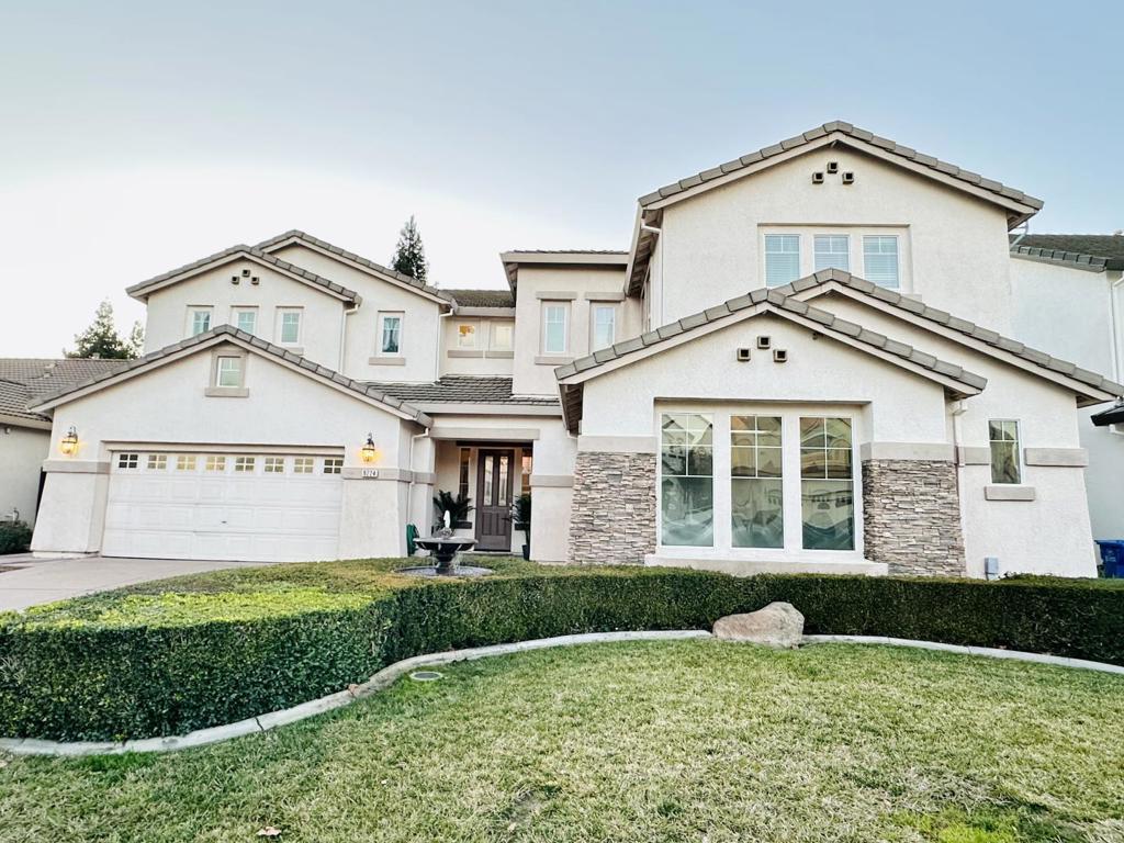 Welcome to this stunning JMC model home 4-5 bedroom, 4.5-bathroom home located in the desirable city of Elk Grove. Spanning 3,565 square feet, this residence offers a spacious and comfortable living experience. The newly remodeled modern kitchen is a chef's delight, featuring a gas cooktop, waterfall quartz countertops, a waterfall island, a built-in microwave oven, and a pantry for ample storage. The home includes a variety of amenities such as a new HVAC system, whole house crown molding, wallpaper bathroom, a dedicated office space, built-in vacuum system, video/audio system, walk-in closets, entertainment room, and a wet bar for your entertainment needs. This home boasts laminate, tile, and vinyl/linoleum flooring throughout, providing durability and easy maintenance. Enjoy cozy evenings by the fireplaces in the separate family room and master bedroom. Laundry convenience is enhanced with electricity hookup (220V), tub/sink, and facilities located on the upper floor. The property is situated within the Elk Grove Unified School District. With a generous Cul-De-Sac minimum lot size of 7,275 square feet and a 3-car garage, this home provides plenty of space for all your needs. Don't miss the chance to make this exceptional property your new home!