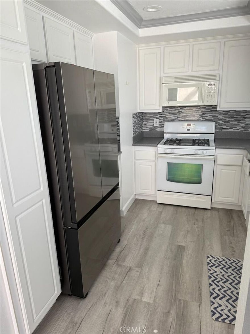 Located in Center of the tract and an End Unit which is most The  Desirable "Pacific" Model. This is a Turnkey Home That is Move right in. It has been totally Remodeled. Featuring a Light & Bright Kitchen with New Recessed Lighting, White Cabinets, Upgraded Sink, Faucet, Countertops & Backsplash. Property has All New Laminate  flooring and New Carpeting. Refrigerator, Washer are Dryer Included. Replaced dual pane windows and Sliders. Sliding Glass doors have Eletronic Remote Control Shades. Newly Painted. Home has Multiple Skylights and plumbing has been Re Piped. Both Bathrooms have been remodeled. One Car Garage located steps away. LandMark Senior Community is noted for it's central location in Huntington Beach and all Amenities with a Very Active Population.



r