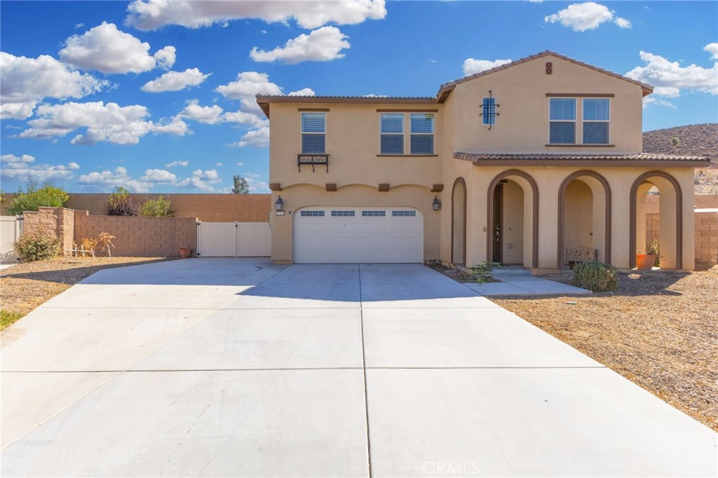 RV Parking & No HOA!
Welcome to this beautiful home in Menifee, offering the perfect blend of style, space, and convenience. The first thing you’ll notice is the stunning curb appeal and inviting front courtyard, perfect for relaxing evenings outdoors.
Inside, you’ll love the open floor plan with luxury vinyl flooring, a spacious great room with a cozy gas fireplace, and a chef’s kitchen featuring granite counters, stainless steel appliances, double ovens, rich cabinetry, and a huge breakfast bar for family and friends to gather around.
The main floor includes a private guest suite, while upstairs you’ll find the luxurious owner’s suite with dual sinks, oversized shower, and views of the hills. Secondary bedrooms are generous in size and connect to a versatile loft ideal for a home office, gym, or media room.
Step outside to a large, covered patio overlooking the low-maintenance backyard with raised brick planters. And here’s the best part: this home comes with gated RV access and NO HOA giving you the freedom to truly enjoy your property.
Additional features include upgraded window coverings, indoor laundry with storage, and block wall + vinyl fencing for extra privacy. Conveniently located near shopping, dining, and freeway access, this home checks every box!