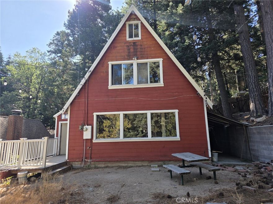ALMOST LEVEL ENTRY. GREAT CABIN ON LARGE LOT WITH BEAUTIFUL MOUNTAIN VIEWS. CHARMING ROCK FIREPLACE. GREAT SHED FOR STORAGE. NEWER CONCRETE DRIVEWAY. ROOM TO TURN AROUND AT TOP. 2 BEDROOMS ON SECOND FLOOR WITH NICE VIEWS. BEAUTIFUL KNOTTY PINE CEILINGS.  VINYL WOOD TYPE FLOORING, EXCEPT TOP FLOOR BEDROOM IS CARPET. TOP FLOOR BEDROOM IS FUN FOR THE KIDS. YOU MUST ENTER THE THIRD FLOOR THROUGH THE BEDROOM CLOSET. STEPS ARE STEEP TO TOP FLOOR. FRESH INTERIOR PAINT.