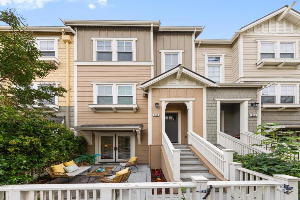 A beautiful townhouse built in 2016 in an prime location. Just across or walking distance to Google, Microsoft, Meta, Intuit,& other major tech companies. Close to Castro Street dining & shops, Shoreline Park, Caltrain access, & top-rated schools: Crittenden Middle, Los Altos High, & Stanford University. The gated entry opens to a covered porch. A short staircase leading into an open & airy floor plan filled with natural light. The home features modern finishes, tile flooring, & recessed lighting. The kitchen features granite countertops & backsplash, a large center island, ample cabinetry, & stainless steel Bosch appliances: including a gas range, oven, built-in microwave, dishwasher, & Whirlpool refrigerator. Balcony access from the kitchen & dining area. Features 4 BD & 3.5 BA, including a first-floor bedroom & full bath, ideal for guests or an office. The upper-level primary suite offers a walk-in closet & en-suite bathroom, while additional bedrooms share a modern hallway bath. A half bath serves the main living area for convenience. Additional highlights include a 2-car attached garage, a washer & dryer in-unit, and rooftop solar panels for energy efficiency. Modern living meets unbeatable location, your perfect Mountain View home awaits!