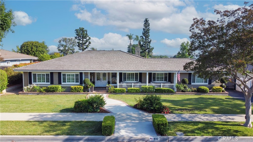 Welcome to this beautifully updated single story home in the heart of North Glendora, where timeless charm meets modern upgrades in every detail. Nestled on a quiet street in a highly sought-after neighborhood, this entertainer’s dream offers an inviting open-concept layout and a spectacular backyard oasis.
Step inside to discover hardwood flooring laid on a unique 45-degree angle, vaulted ceilings with exposed beams, and a stunning kitchen remodeled in 2022. The kitchen features custom cabinetry with crown moulding, granite countertops, a farmhouse sink, built-in drawer-style microwave, double-drawer dishwasher, stainless steel appliances, under-cabinet lighting, and soft-close, extra deep drawers. A large pantry with pull-out shelves, coffee bar area, and breakfast bar complete this entertainer’s kitchen, seamlessly opening to the spacious family and dining areas.
French doors lead to a backyard paradise with a resurfaced and retiled pool and spa (2023), gas firepit, outdoor lighting, automatic sprinklers, and a custom drive through gate. Inside, the primary suite is a serene retreat with vaulted ceilings, a walk-in closet with built-ins and barn doors, and a spa-inspired bathroom remodeled in 2023 featuring a custom frameless glass shower and soft-close cabinetry.
Additional highlights include: a full bathroom with Jacuzzi tub and frameless enclosure, upgraded vinyl windows, plantation shutters, crown and base moulding, custom solid-core bedroom doors, and hallway cabinetry. All exterior walls have been insulated, with new R30 attic insulation throughout. A separate laundry room includes custom cabinetry and unique tile flooring, adjacent to a guest bath. Bonus attic room is carpeted and air-conditioned, and there’s a dedicated office space with built-in cabinetry.
The home also boasts a custom oversized front porch, automatic holiday light outlets in the eaves, closet organizers in all bedrooms, brick planters, and a newly remodeled gas fireplace with custom mantle and rock detail.
This is a rare opportunity to own a truly turnkey property in one of Glendora’s most desirable neighborhoods!