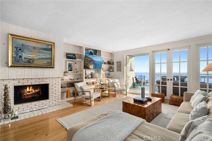 Enrich your life with ultimate luxury at this stunning single-level coastal home that welcomes the unparalleled

beauty of panoramic ocean views spanning breaking waves, beautiful coves, Catalina Island and magical

sunsets. Across from the sand in North Laguna Beach, this top-level condo is tucked away in a small,

upscale development of only nine units and presents two bedrooms, an office and two baths in

approximately 1,440 square feet. It is ideal as a lock-and-go vacation home and a year-round residence,

complete with a fireplace-warmed living room that opens via French doors to an oversized deck with

breathtaking Pacific Ocean views. Beautiful vistas embellish the living room, a dining room with mirrored

accent wall, and the fully renovated kitchen, which features today’s most desirable appointments. Enjoy a

double-waterfall island, quartz countertops, custom white cabinetry with glass uppers, a full tile backsplash

and pantry. Preferred stainless steel appliances include a built-in Sub Zero refrigerator, high-end 5 burner Wolf range and a drawer

microwave. Introduced by a Dutch door and an entry with skylights, the home displays wood flooring, an

interior washer and dryer, elegant lighting, and one bedroom that opens to a large front patio. One covered

parking space is included. Friends and loved ones will enjoy joining you on strolls to shops and restaurants

right across the street, Heisler Park, and Shaws, Divers and Fishermans coves. Village galleries are nearby,

and Laguna’s Main Beach, with its chic boutiques and charming cafés, is minutes from home. Realize your

dream of experiencing the cherished Laguna Beach lifestyle today at this fabulous move-in-ready ocean-

view penthouse. Located in prestigious North Laguna on the ocean side of Pacific Coast Highway, it is a

genuine once-in-a-lifetime opportunity.