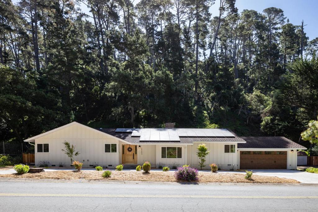 Enjoy living in the coveted Carmel Views neighborhood with easy access to shopping, restaurants and the local beaches. Step into this remodeled single-level sanctuary, where an elegant living room showcases a striking fireplace and coffered ceiling, flowing gracefully into a formal dining area. The heart of the home features a gourmet kitchen with an expansive center island, perfect for both casual dining and entertaining, opening into the family room designed for modern living. Retreat to the primary and secondary bedrooms, each offering access to a deck overlooking a generous garden area an ideal canvas for your orchard and vegetable gardens. Set on a flat homesite before the street heads up the hills, with ample space for additional vehicles and situated in the prestigious Carmel school district, this turnkey residence masterfully blends refined elegance with practical living.