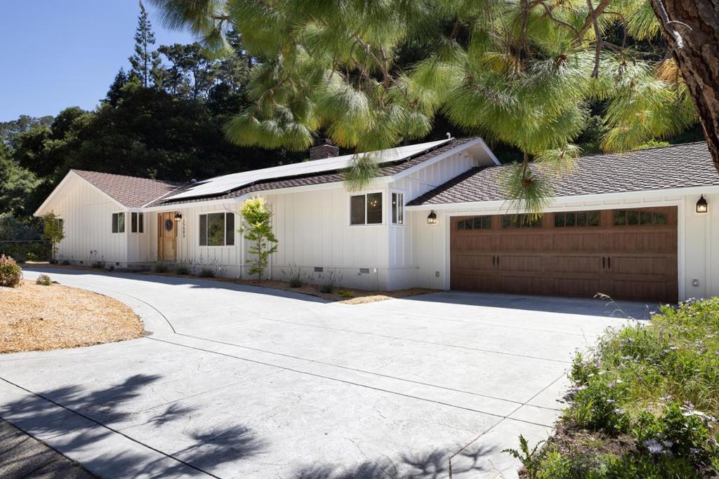 Enjoy living in the coveted Carmel Views neighborhood with easy access to shopping, restaurants and the local beaches. Step into this remodeled single-level sanctuary, where an elegant living room showcases a striking fireplace and coffered ceiling, flowing gracefully into a formal dining area. The heart of the home features a gourmet kitchen with an expansive center island, perfect for both casual dining and entertaining, opening into the family room designed for modern living. Retreat to the primary and secondary bedrooms, each offering access to a deck overlooking a generous garden area an ideal canvas for your orchard and vegetable gardens. Set on a flat homesite before the street heads up the hills, with ample space for additional vehicles and situated in the prestigious Carmel school district, this turnkey residence masterfully blends refined elegance with practical living.