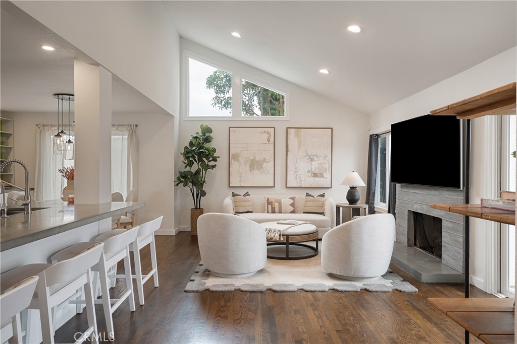 Welcome to 2336 Elden Ave Unit A — a beautifully updated 2-bedroom, 2.5-bathroom gem located in the highly desirable Eastside Costa Mesa neighborhood. This 1,550 sq ft home blends modern upgrades with timeless architectural charm, offering comfort, convenience, and California living at its finest.
Step inside to discover a vaulted sloped ceiling, real wood floors, and abundant natural light from clerestory windows and skylights. The kitchen features a brand-new stove, refrigerator, faucet, and filtered water system. Enjoy seamless living with a Nest thermostat, Ring doorbell, keyless entry, tankless water heater, WiFi-enabled garage door opener, and recessed lighting throughout. The attached 2-car garage includes an epoxy floor and in-garage laundry with washer and dryer included.
Retreat to spacious bedrooms with en-suite bathrooms, enhanced by skylights for added brightness. Entertain outdoors with four distinct patio spaces, including a currently unused space to add a small potential yard, as well as an expanded patio with a refreshed gas/wood-burning firepit and new insert — perfect for Southern California evenings.
Additional highlights include central AC/heat, board-and-batten accents in the hallway, a secure alarm system, and an electric vehicle charging station.
Located just minutes from local hotspots, residents love the easy access to trending restaurants, shopping at South Coast Plaza, hiking at the Back Bay, and top-rated schools. You’ll also enjoy the friendly neighborhood vibe and close proximity to beaches and freeways.
Don’t miss your chance to own this turn-key home in one of Costa Mesa’s most sought-after areas!