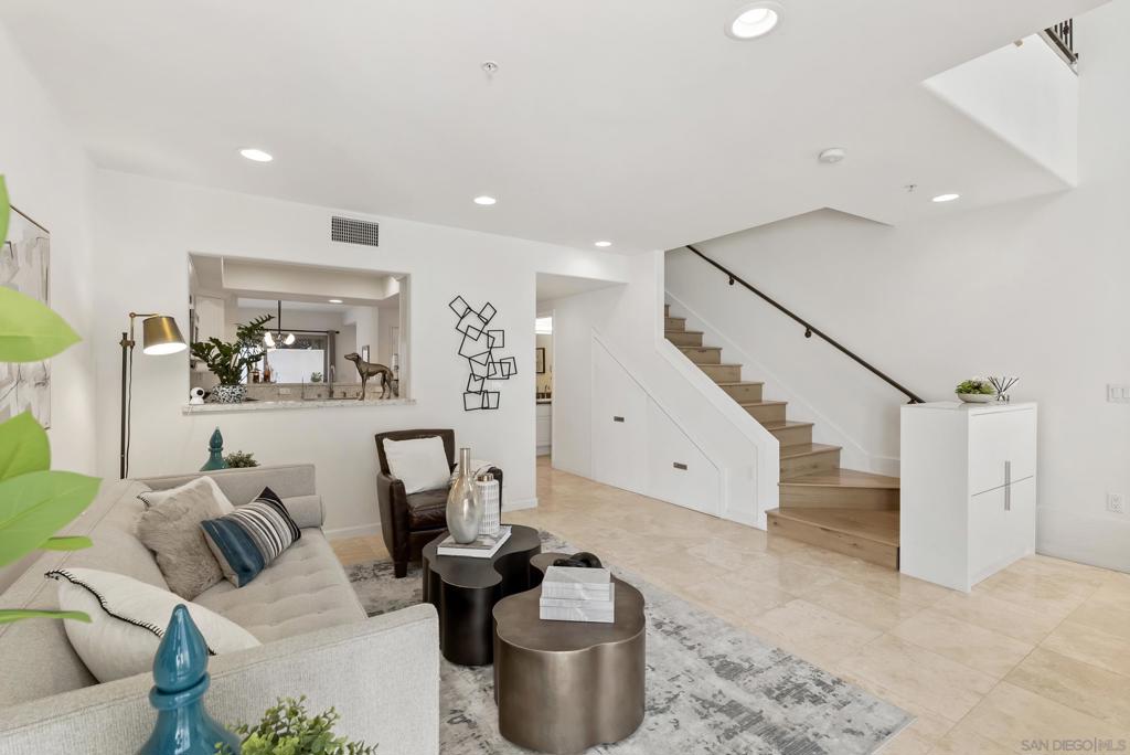 Elegant townhome located in the sought-after La Jolla Village, just a short walk from Bishops, Windansea Beach, The Cove, Prospect and Girard, the library, recreation center, parks, tennis courts, gyms, restaurants, shops, and entertainment. This home features a private elevator servicing all levels, a private 3-car garage, and three secluded patios. The entire third floor is dedicated to a luxurious master suite with a fireplace and balcony, 2 junior suites with their own ensuite bathrooms on 2nd floor. Fully paid solar panels. Sustainable and Convenient: Enjoy lower energy bills with newer owned solar panels and a Tesla charger already installed—perfect for eco-conscious living. Post-Beach Comfort: After a refreshing day at the beach, rinse off with the hot water shower in the garage—ideal for sandy feet and salty skin.