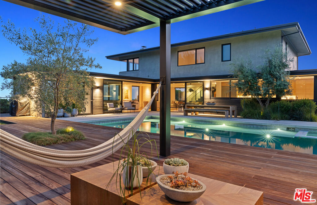 Experience luxury living elevated atop Los Feliz Estates with jetliner city views that are impossible to obstruct. 2216 Winona is a testament to a modern and minimalist lifestyle through its cutting edge design and calming energy. Delicately crafted with refined finishes and exotic materials, this extraordinary space was conceived with beauty and intellect in mind to stir all of the senses leaving no detail forgotten. An invigorating architectural vision, this residence features an open floor plan that integrates indoor and outdoor living. Interior elements include quartered teak kitchen cabinetry, white oak flooring, a cold rolled steel stair case and Fleetwood sliding glass walls that blend both spaces together seamlessly. Outside enjoy the resort inspired sundeck, cabana lounge and fitness studio. Anchored by the heated salt water pool and spa, this soothing entertainment space rests among the treetops capturing postcard worthy views of Griffith Observatory. All interior and exterior technology components are synchronized through the RTI smart home automation app providing a simple way to command your home. This fully-furnished estate is turn-key. Just moments from Silver Lake, Beachwood Canyon and Hollywood, the 5 and 101 freeways.