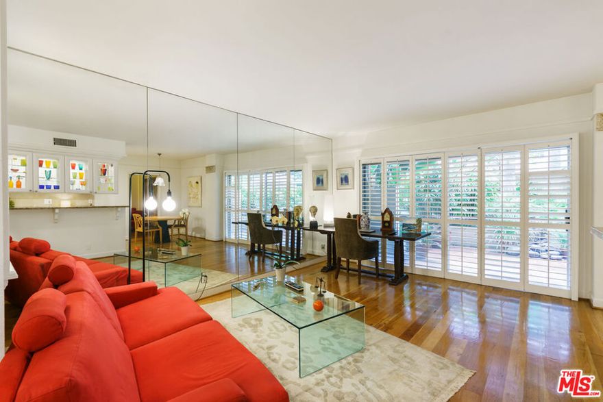 Amazing resort-style living in this stylish 1-bedroom, 1.5-bath condo at PARK WELLINGTON featuring a rare, EXTRA-large partially covered PRIVATE PATIO perfect for outdoor dining, lounging, or entertaining. The open-concept layout showcases contemporary flair with wood floors, an updated kitchen and remodeled baths. A wide sliding glass door floods the living space with natural light and creates an effortless indoor-outdoor flow. The private primary bedroom retreat includes an en suite bath and walk-in closet. Enjoy luxury amenities including a 24-hour concierge, pool with expansive sundeck, gazebo-covered spa, sauna, north/south tennis court, and a fully equipped gym. Ideally located in the heart of the best of West Hollywood, just moments to Sunset and Santa Monica Boulevards' famed dining, shopping, and nightlife, and minutes from Beverly Hills. A rare opportunity PRICED TO SELL!