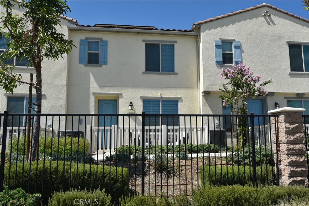 Welcome home to your move in ready Condo located inside of a gated community. Featuring 3 bedrooms, all located upstairs, 2.5 baths , upstairs laundry room, a spacious primary suite, with dual sinks, a walk-in closet with plenty of space. Downstairs features an open concept with a beautiful kitchen, quartz counter tops, an open area that flows right into your living space. This condo also offers a tankless water heater, solar panels, an attached 2 car garage with an electric car outlet ready for you to come home and plug in your electric car! you will also enjoy sitting on your front patio on a nice sunny day, or hanging out at your community pool, or grilling in your communities provided areas. all this and more is within walking distance from shopping centers and lots of eateries. This is a move in ready must see condo, waiting for someone to make it their home!
