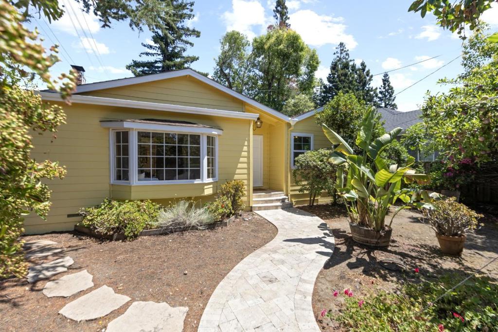 Welcome to this charming West Menlo Park home, offering 1,750 square feet of living space and situated on a good lot size lot of 7,388 square feet. This freshly painted inside and out residence features three spacious bedrooms, and two full bathrooms. The kitchen is a true highlight, boasting granite countertops, dishwasher, microwave, built-in Wolf gas range, exhaust fan, garbage disposal, and refrigerator, with added brightness from a skylight. Flooring throughout includes solid hardwood and tile. Cozy up by the fireplace in the living room, perfect for relaxation. Additional amenities include bay windows in the separate family-room and skylight. The in-home laundry area with washer and dryer ensures convenience. With forced air heating, some double pane windows, 2 useable redwood decks, a two-car garage and, a working water fountain in the backyard. This property combines comfort and practicality. This home is served by Las Lomitas School District and, it is also called University Heights in the unincorporated area of San Mateo County. Near Stanford University and Sandhill Road.